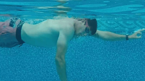 swimmer exhaling underwater